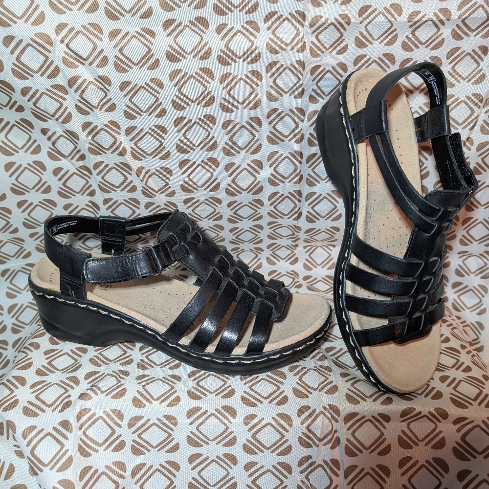 Clark's Elegant Black Sandals with Strappy Design and Low Wedge Heel